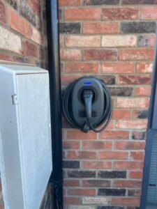 EV charger - Titan Electrical Ltd EV charger on exterior wall