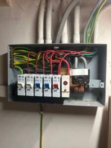 Older Consumer Unit Inspection in Longstanton Cambridge - Titan Electrical Ltd Older consumer unit inspected by electrician in Cambridge during electrical safety inspection in Longstanton