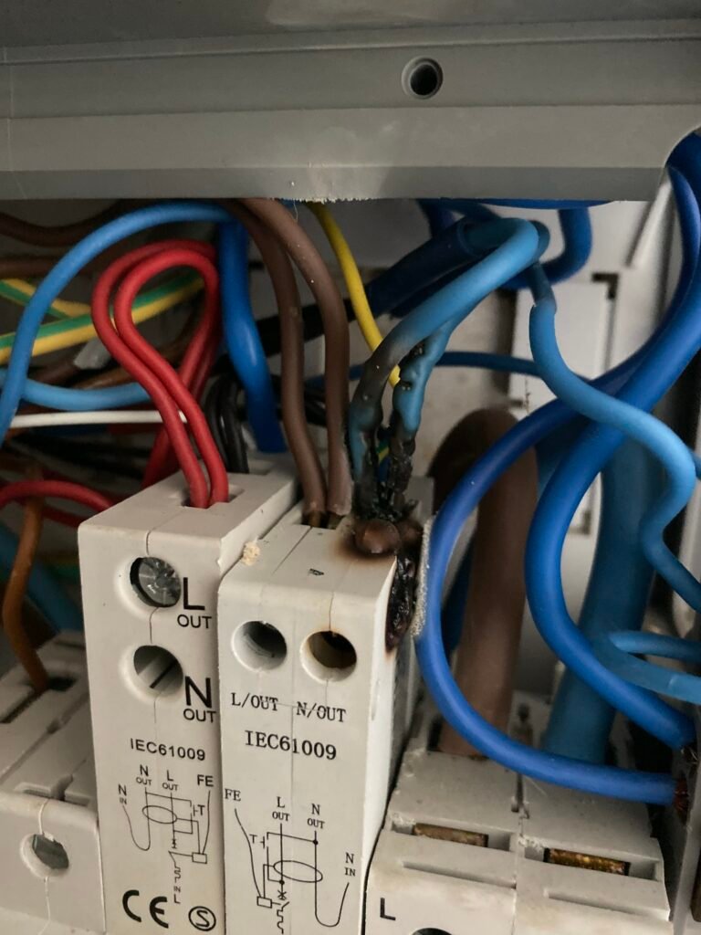 Electrician Cambridge burnt connection inside consumer unit in Riverside